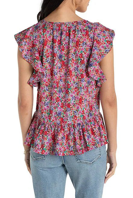 Woman wearing a colorful floral blouse