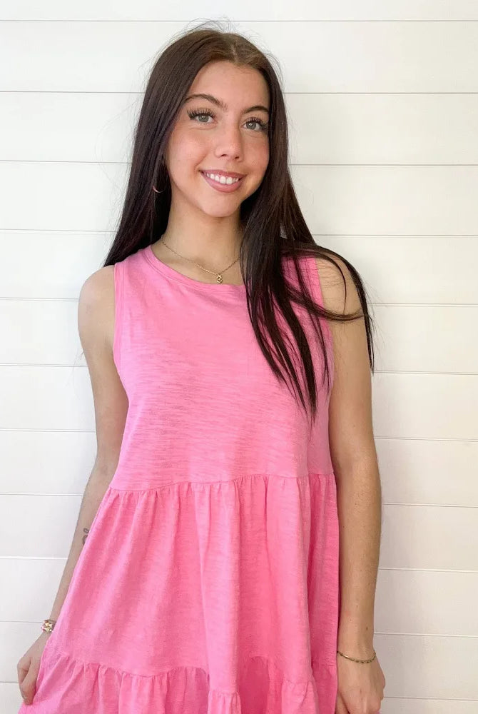 Close-up of teared, candy, pink mini dress