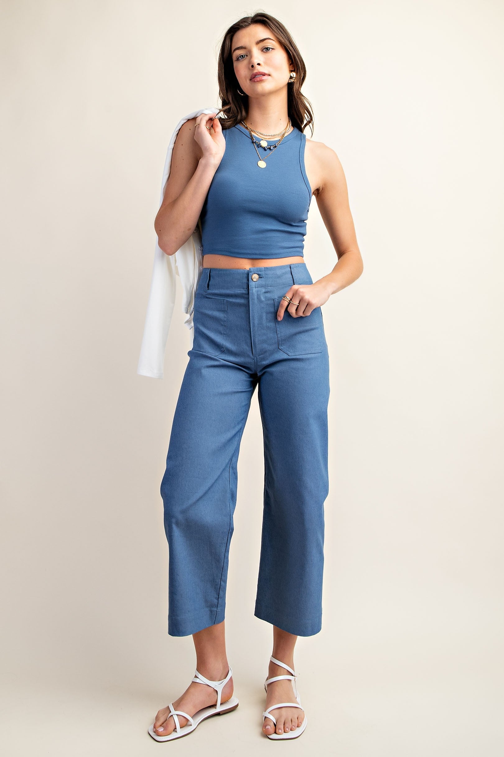 Woman wearing blue ankle cropped pants