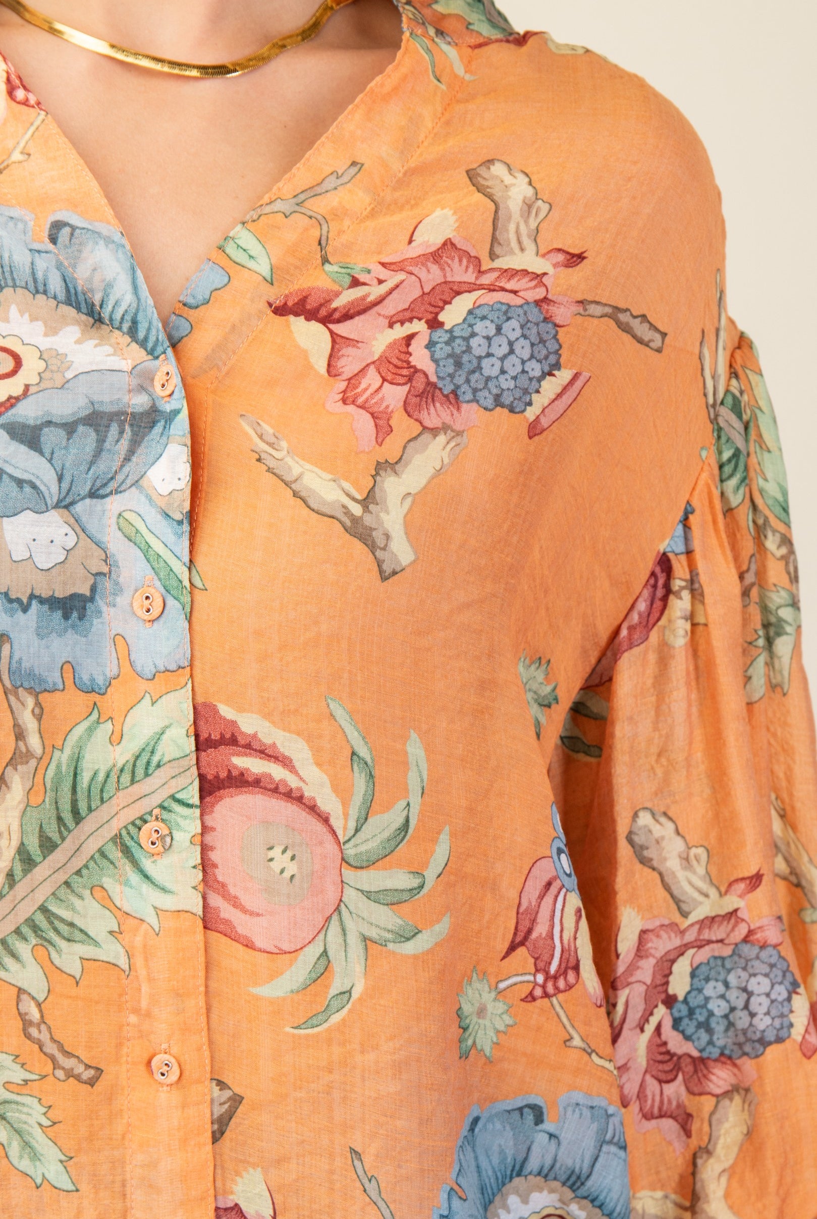 Close-up of a printed top with balloon sleeves