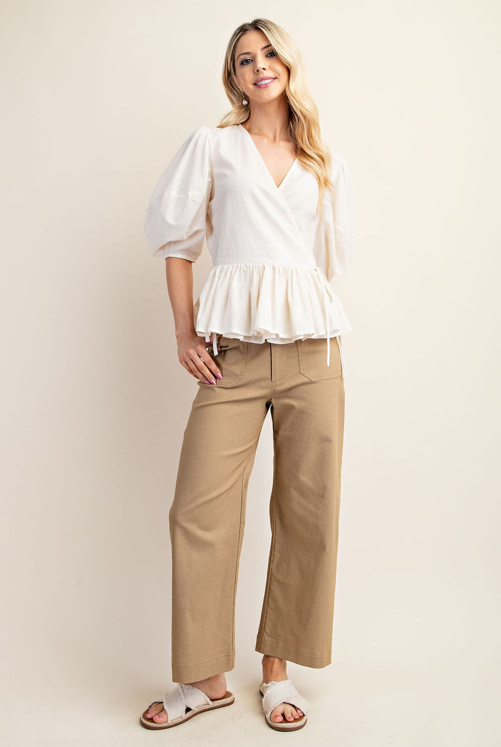 Woman wearing beige ankle cropped pants