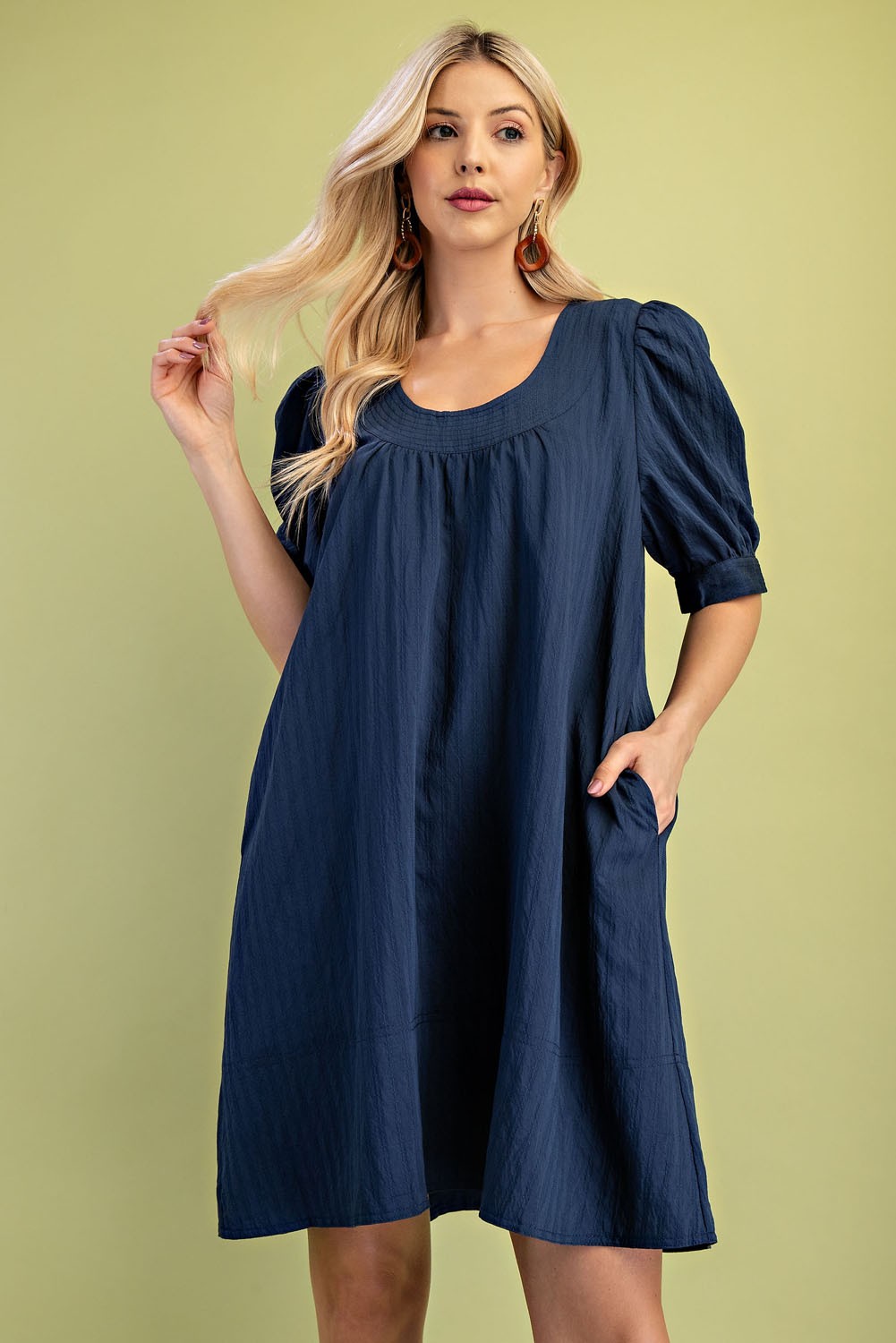 Woman wearing a blue mini dress