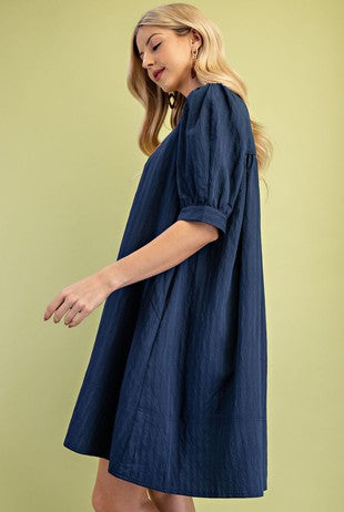 Woman wearing a blue mini dress