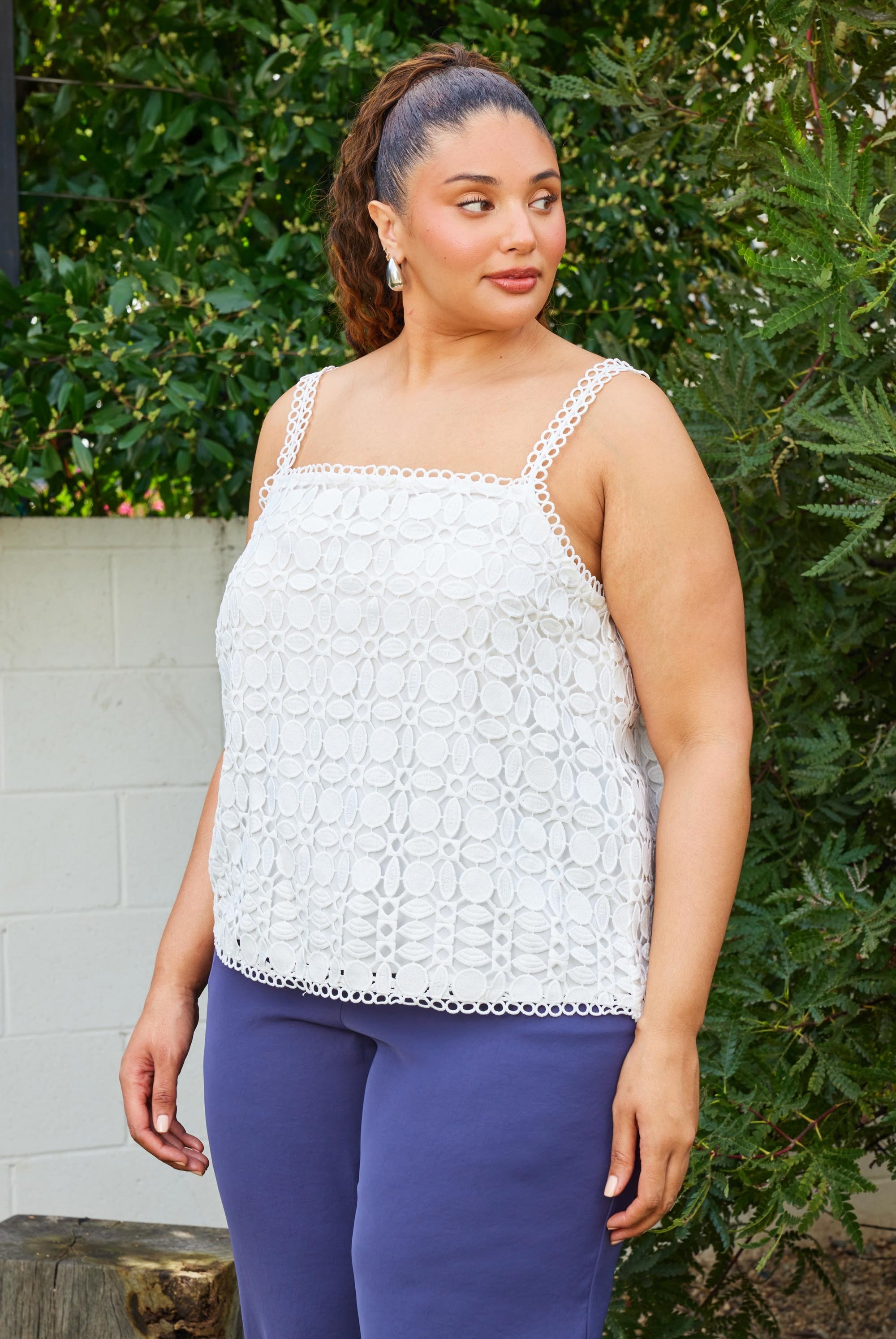 Woman wearing a white lace top