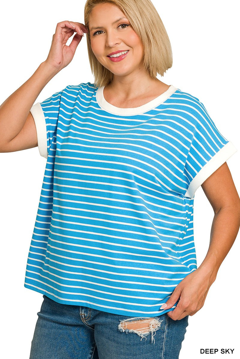 Woman wearing a blue and white striped shirt
