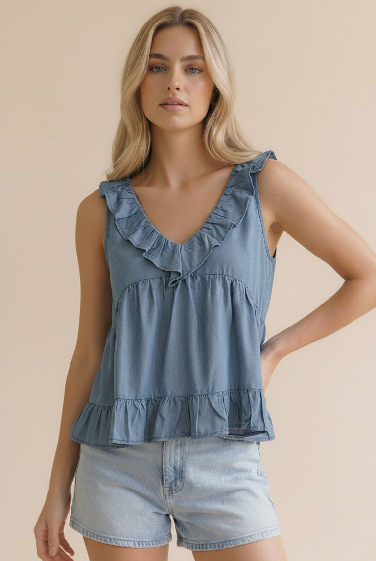 Woman wearing a blue ruffled v neck top