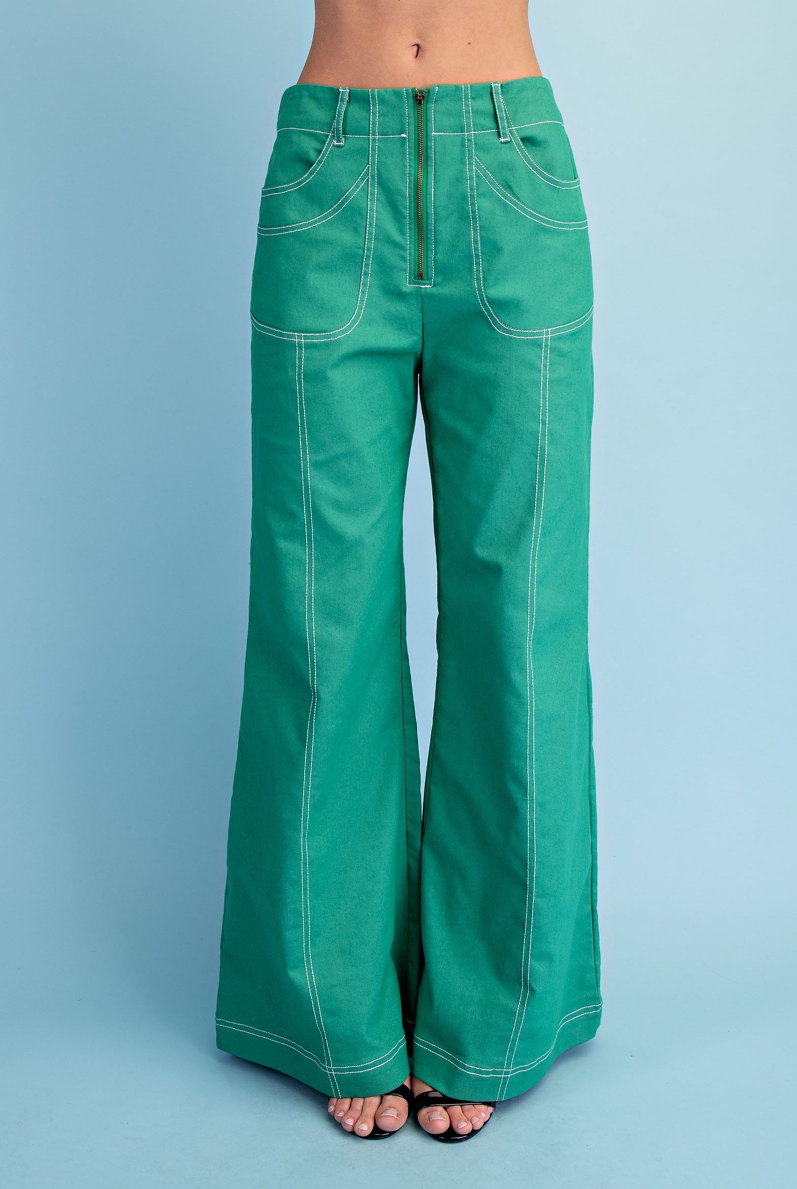 Green pants with exposed seams