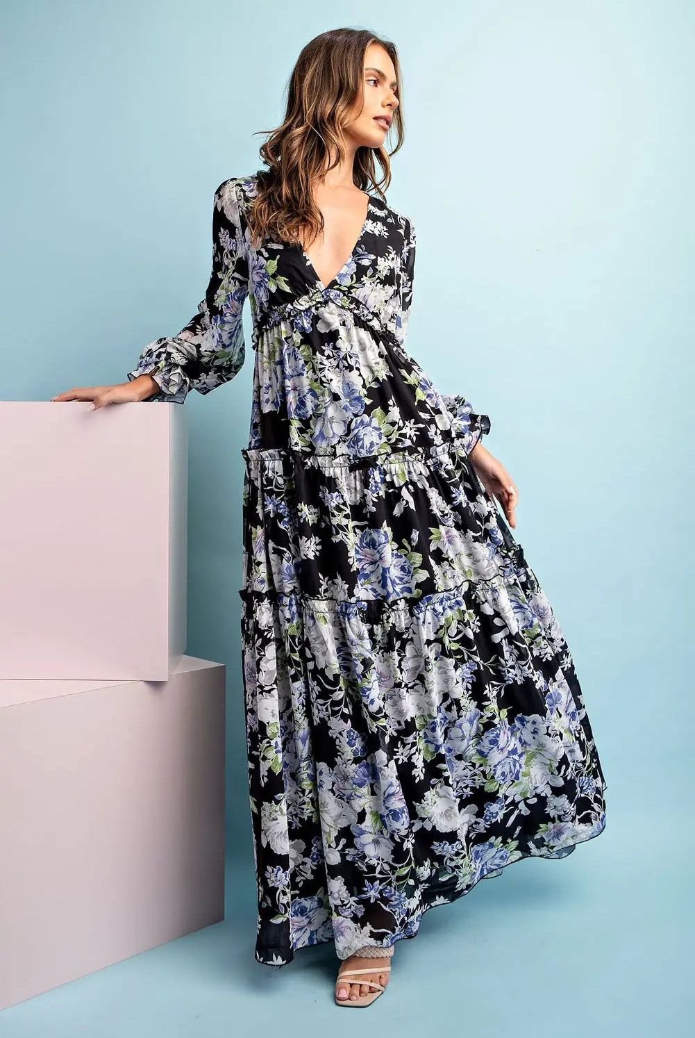 Model wearing long sleeve floral maxi dress