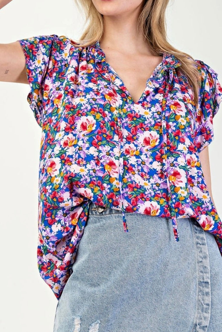 Model wearing Royal blue floral tank With Jean skort