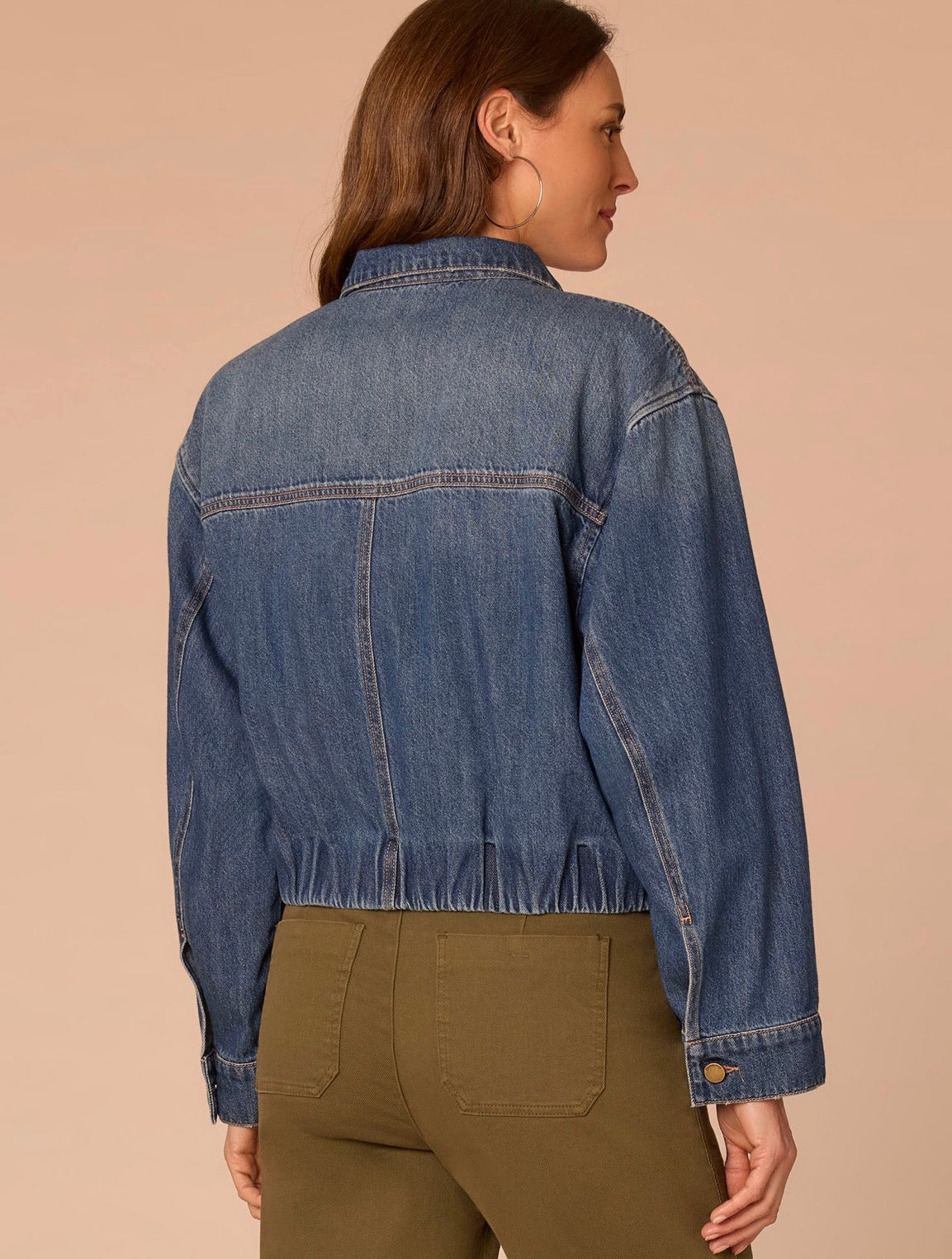 Back view of lady wearing jean jacket