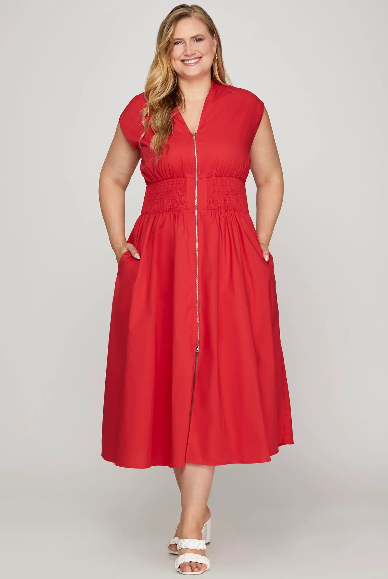 Woman wearing a red dress with a zipper
