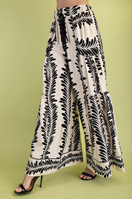 Black and white patterned pants on a green background