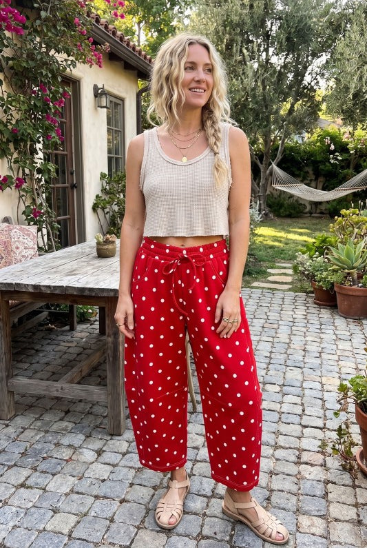 Model wearing red polkadot pants