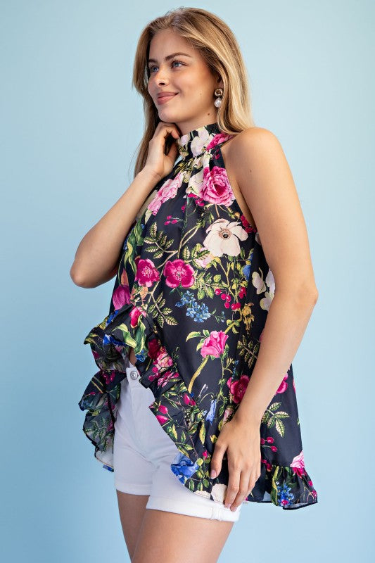 Aside view of high low floral print shirt