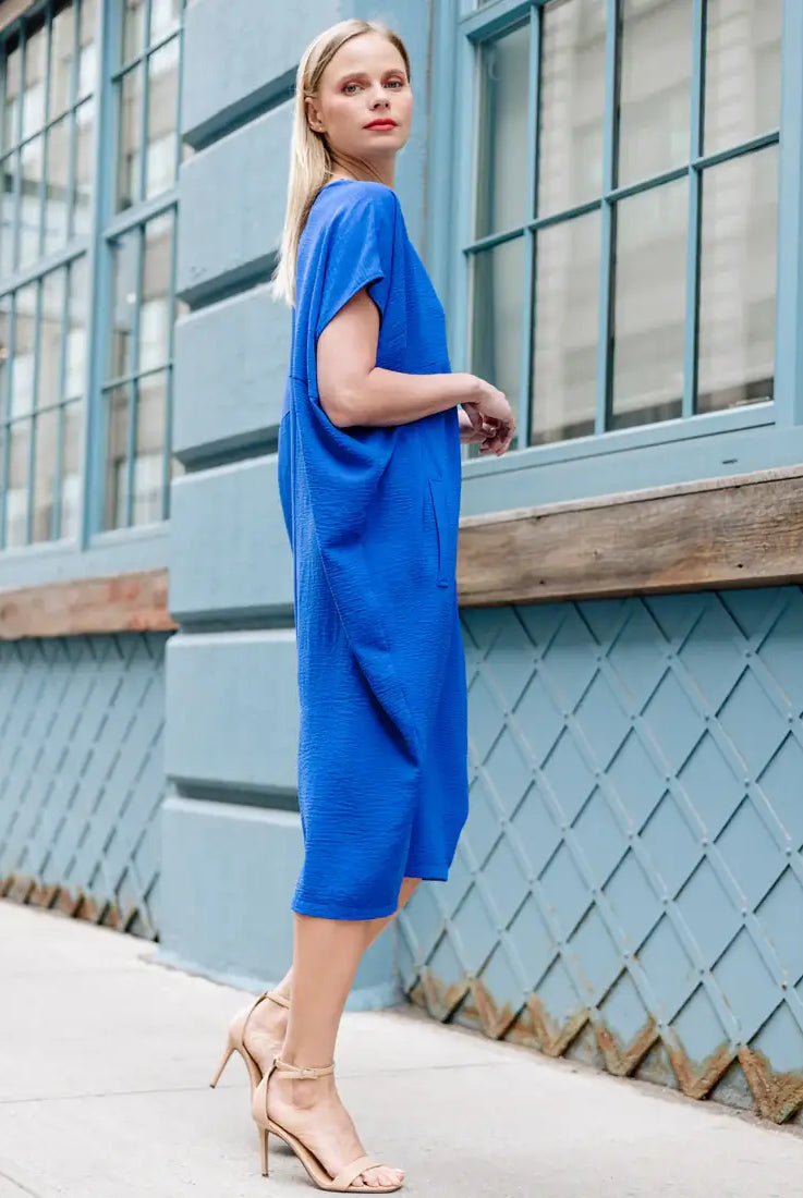 Wearing blue caftan dress