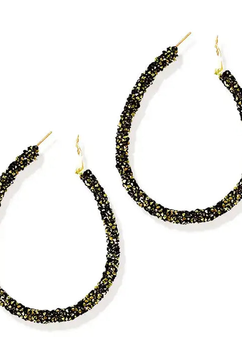 Black and gold earrings on a white background