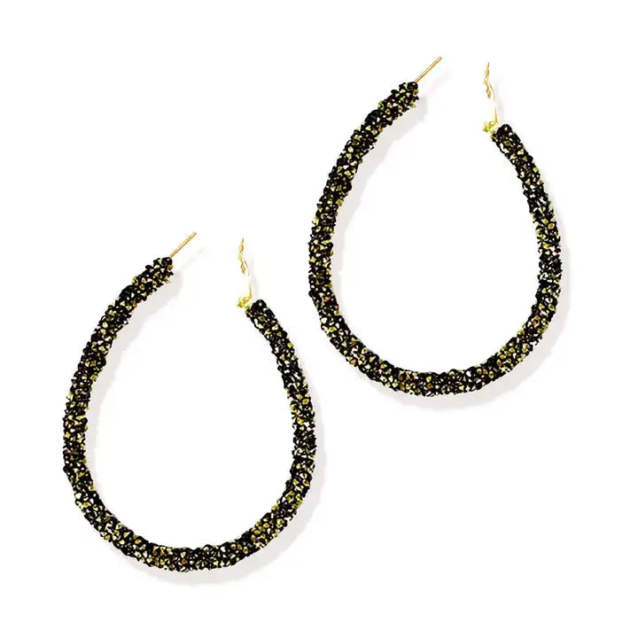 Black and gold earrings on a white background