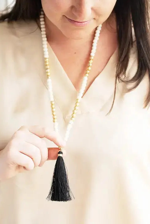 Model wearing black Tori necklace