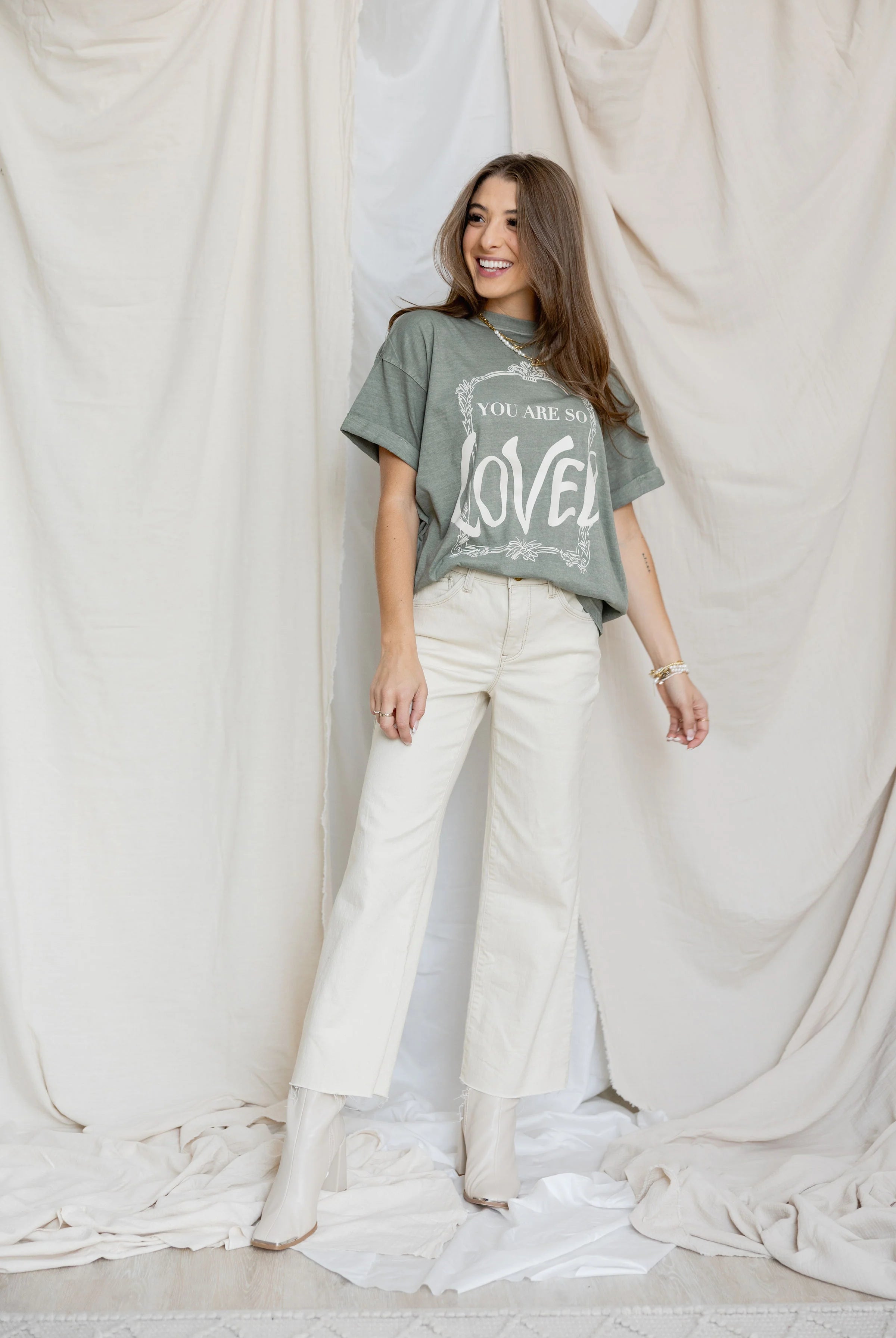 Front view of You are so loved tee and white jeans