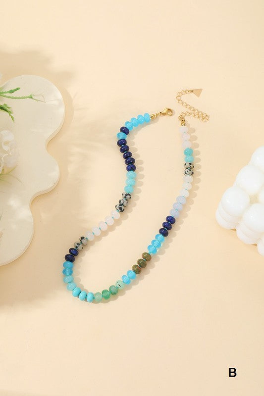 Multicolored beaded necklace on a beige background