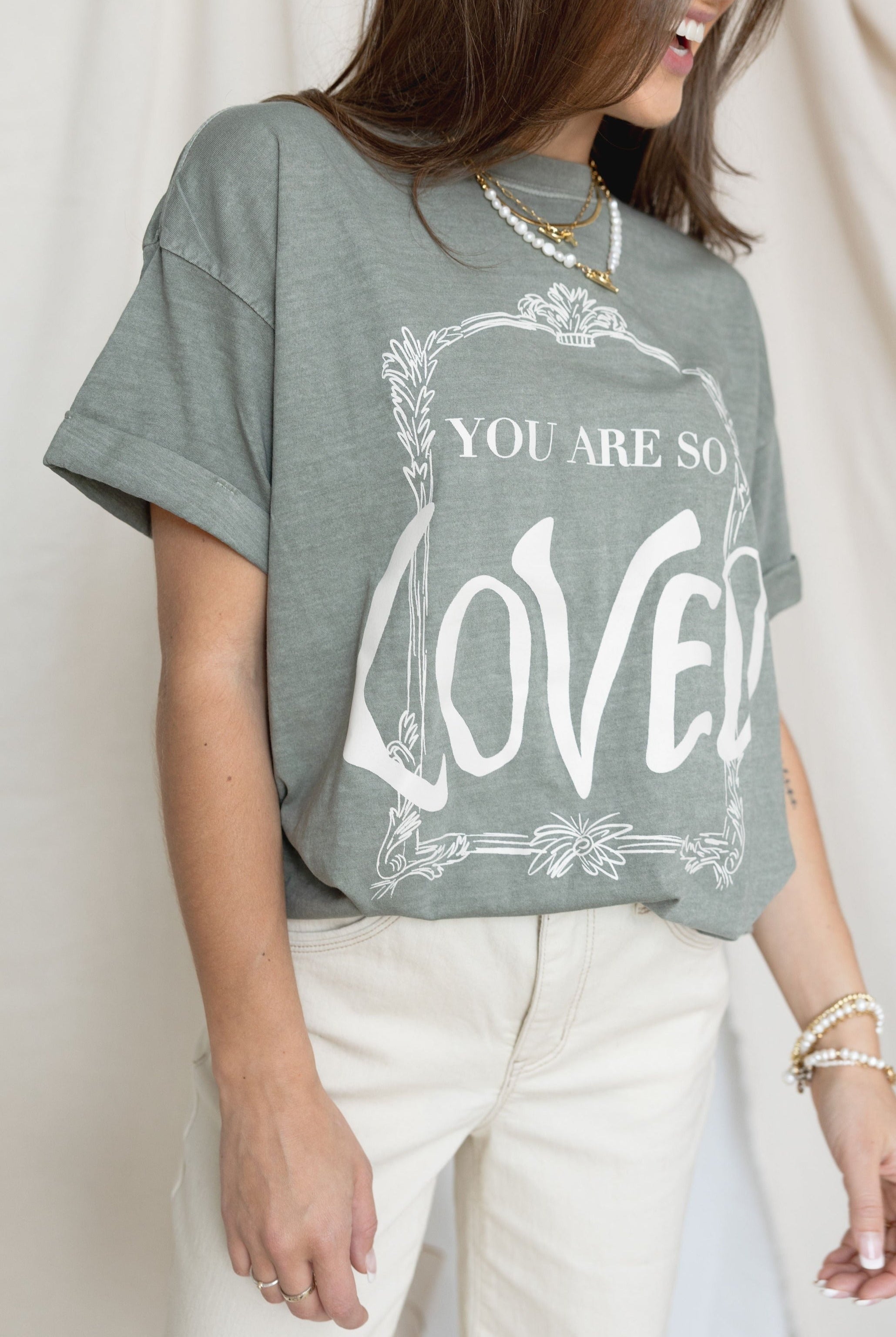 YOu are so loved shirt and white jeans