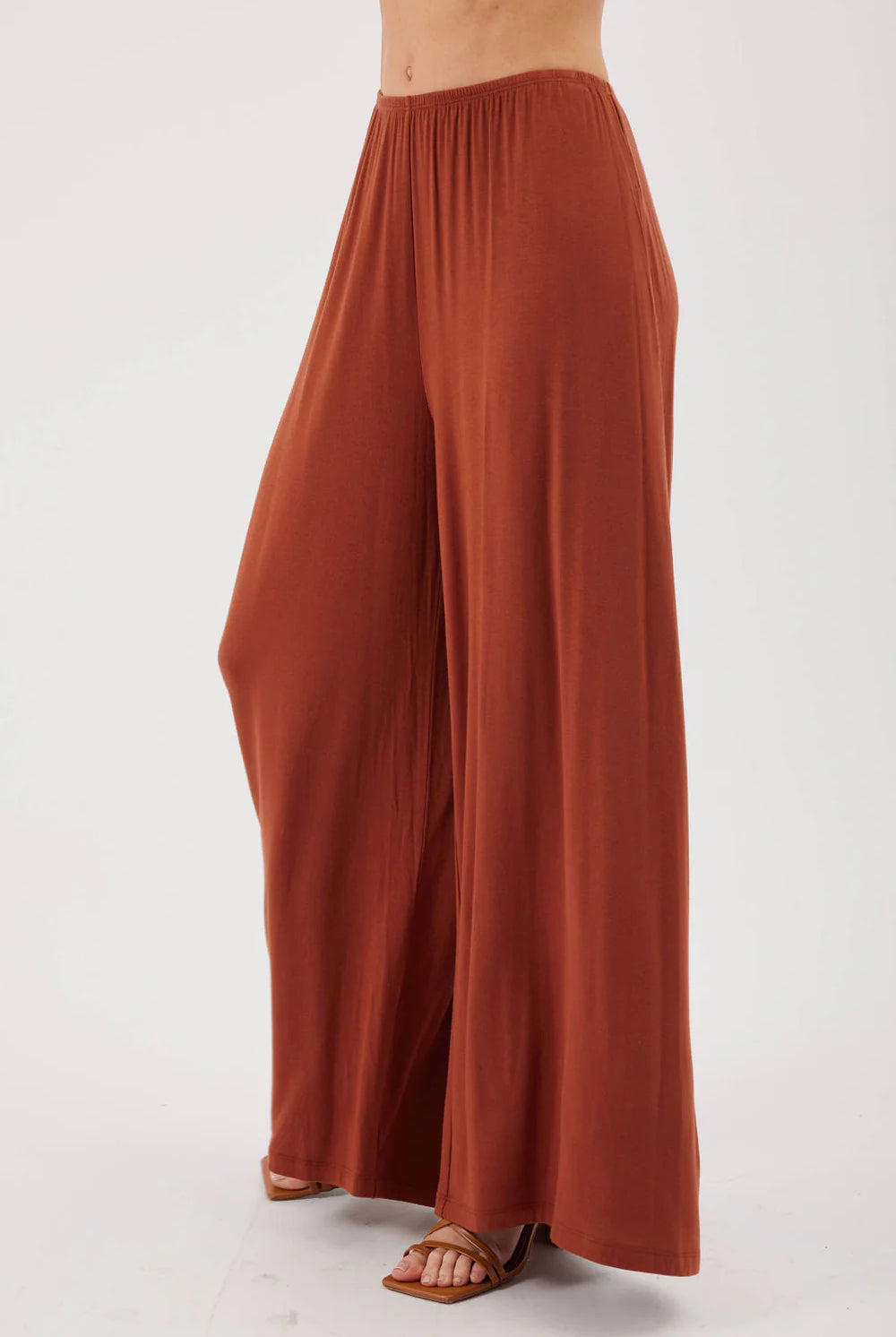 MODEL WEARING NUTMEG PANTS