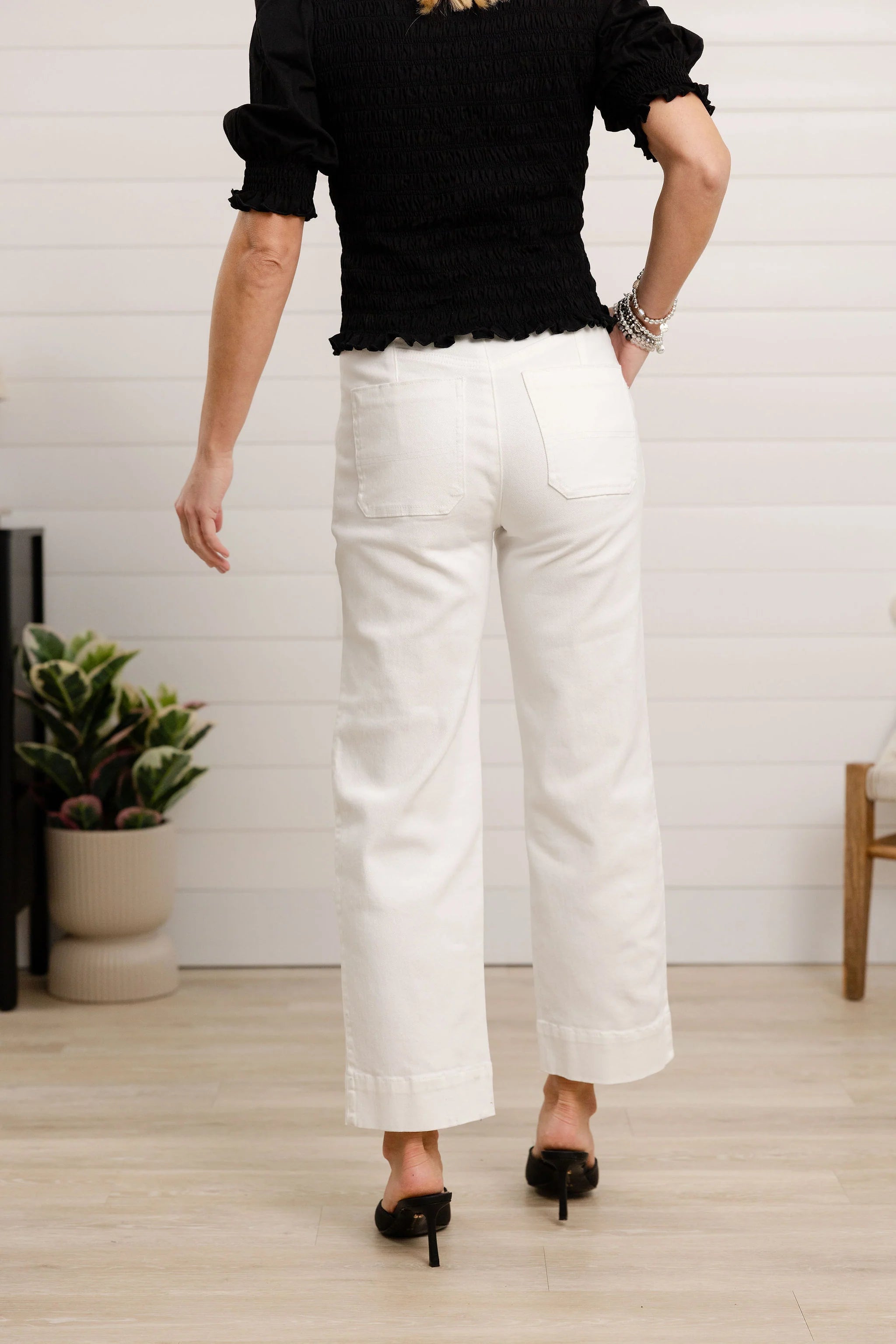 Back view of Person wearing white pants