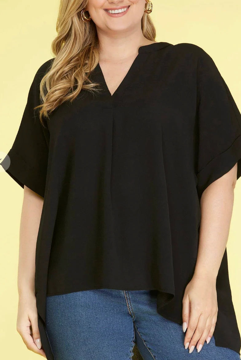 Woman wearing a black stand collar top