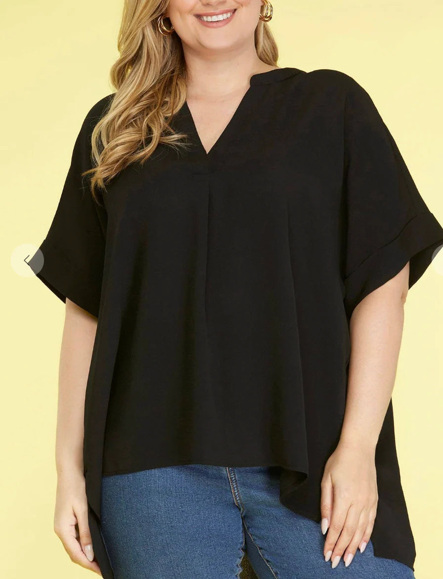 Woman wearing a black stand collar top