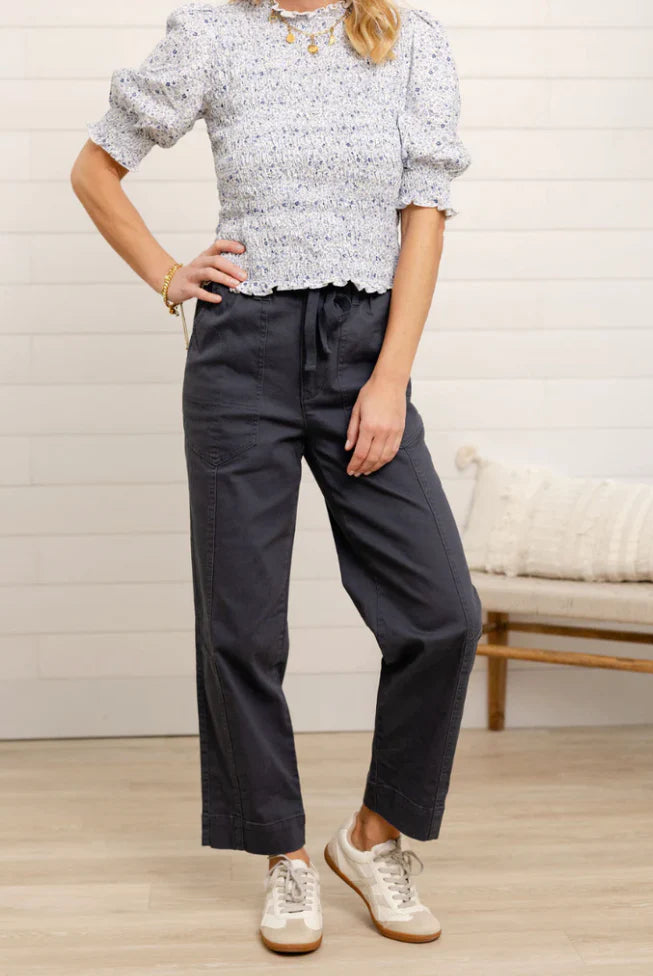 Woman wearing dark straight leg
pants