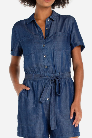 Woman wearing a blue denim romper