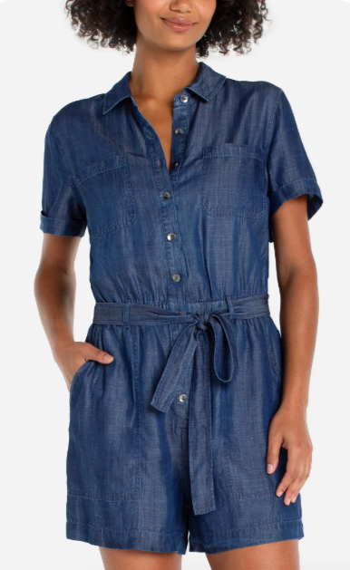 Woman wearing a blue denim romper