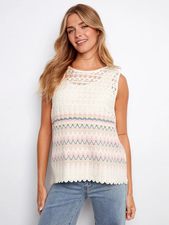 Woman wearing a sleeveless crochet top with colorful patterns