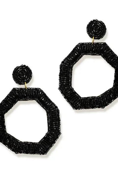 BLACK EARRINGS ON A WHITE BACKGROUND