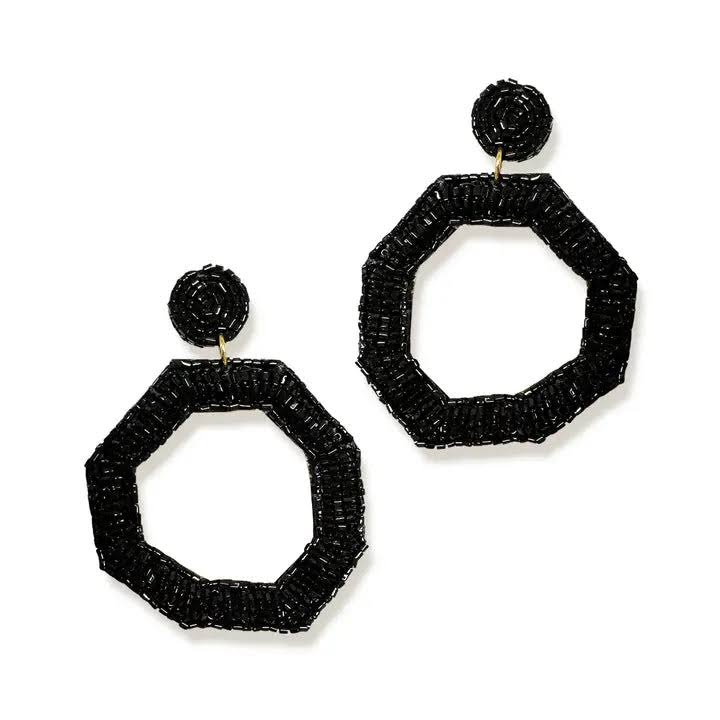 BLACK EARRINGS ON A WHITE BACKGROUND