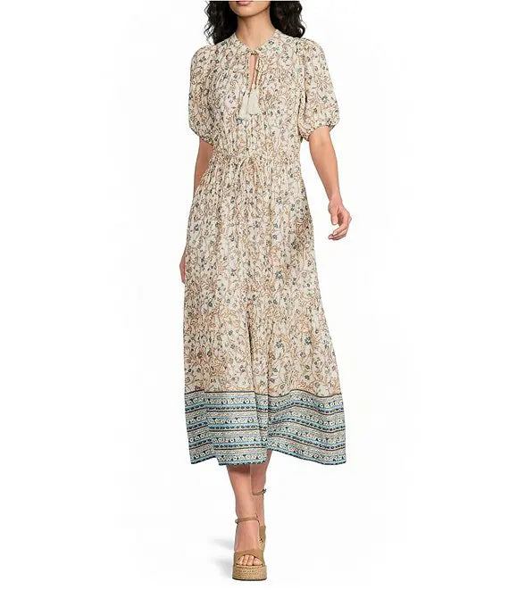 Woman wearing a beige floral dress 