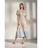 Woman wearing a neutral floral dress