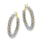 Blue and gold earrings on white background 