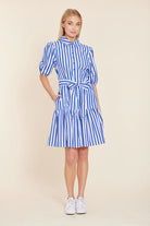 Woman wearing a blue and white striped dress