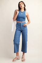 Woman wearing blue ankle cropped pants