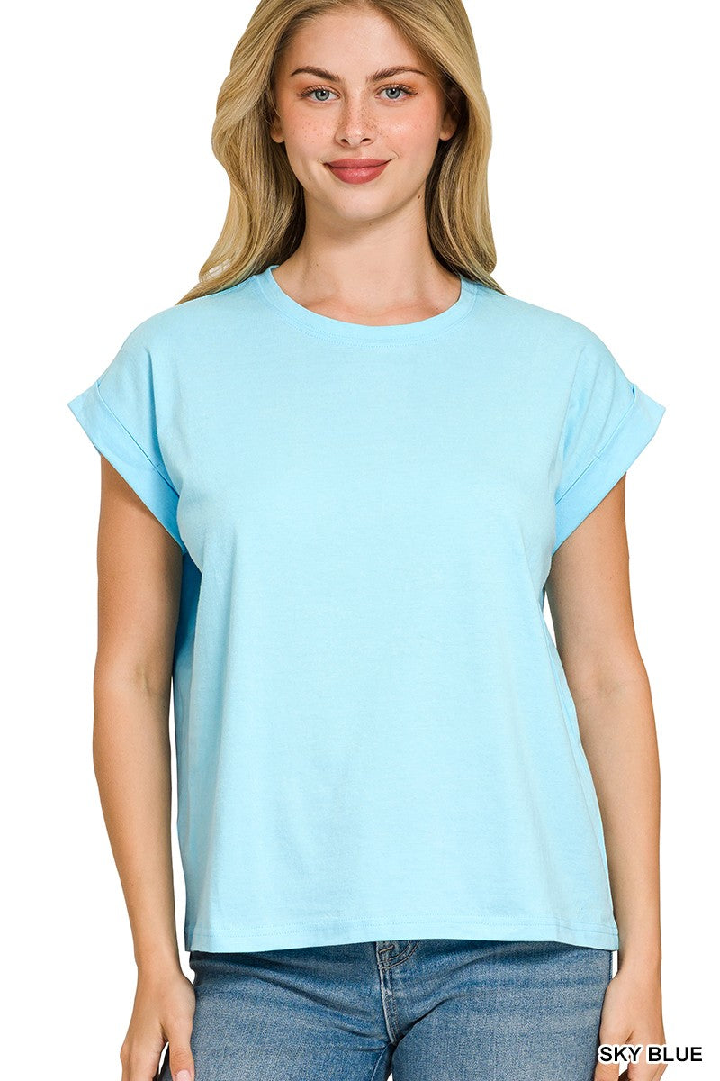Woman wearing a light blue t-shirt with folded sleeves 