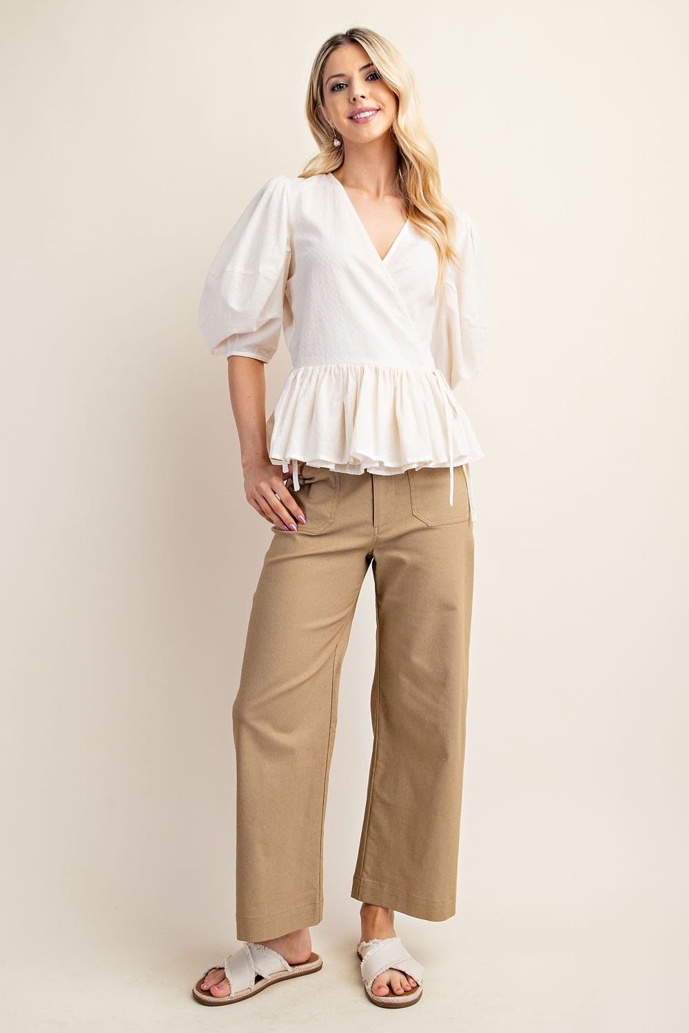 Woman wearing beige ankle cropped pants