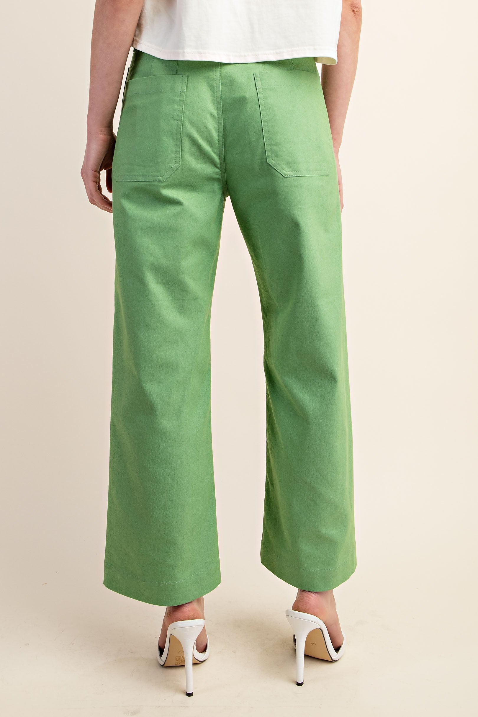 Back of green crop pants 