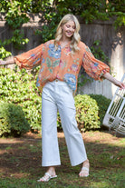 Woman wearing a printed top with balloon sleeves