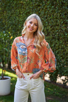 Woman wearing a colorful printed top