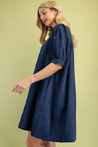 Woman wearing a blue mini dress 
