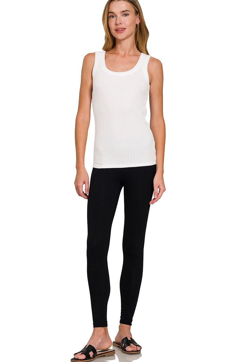 Woman wearing a white tank top 