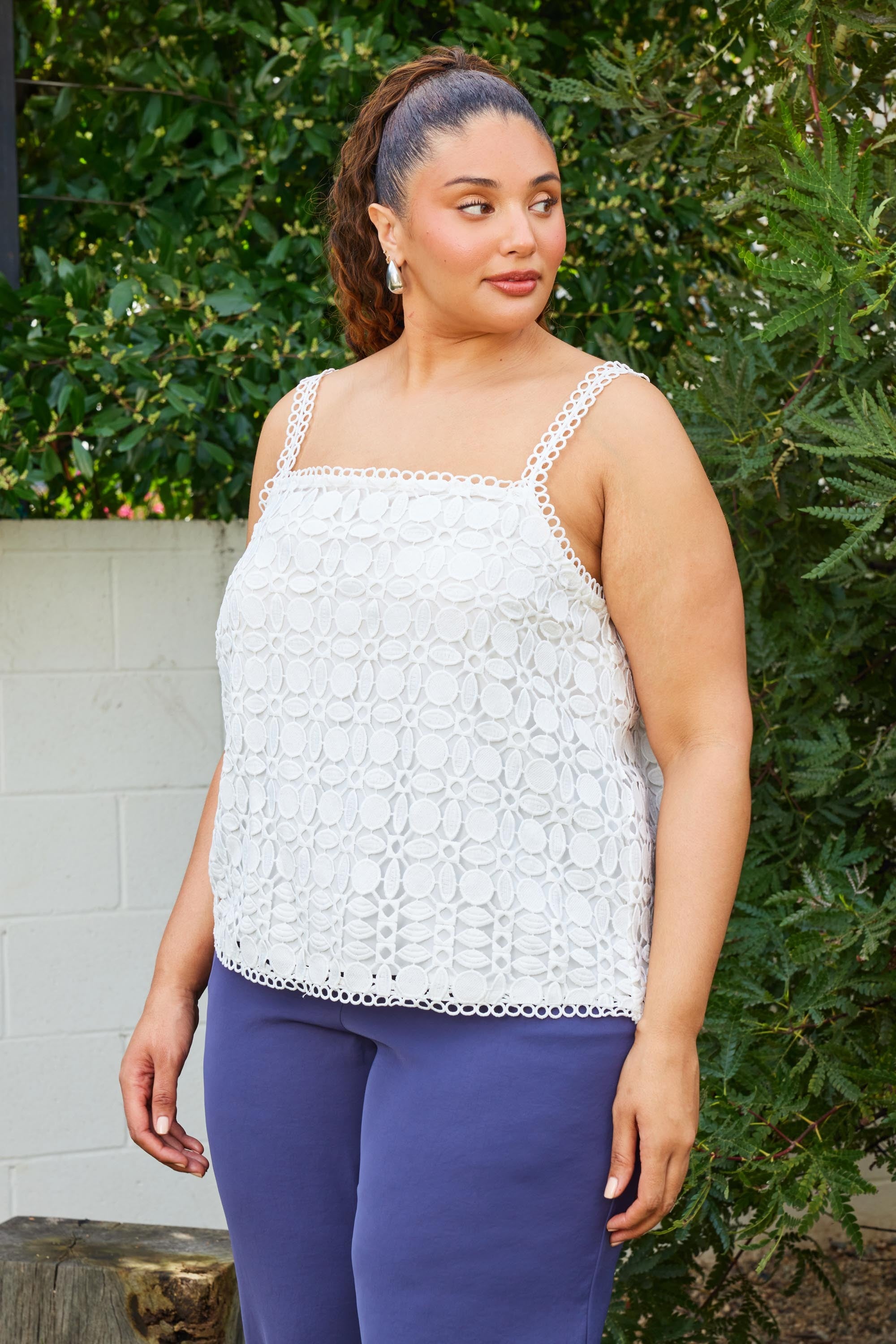 Woman wearing a white lace top 