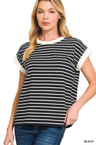 woman wearing a white and black stripe t-shirt. 