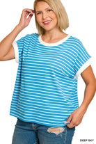 Woman wearing a blue and white striped shirt 